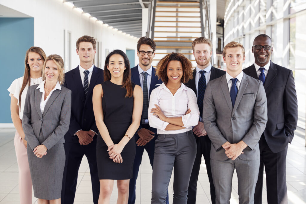 A group of corporate employees standing 